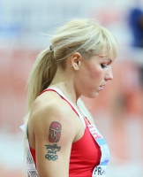 TATTOO SPORT. Yana Maksimova, BLR. A tattoo on a shoulder with a symbol of the Beijing Olympic Games